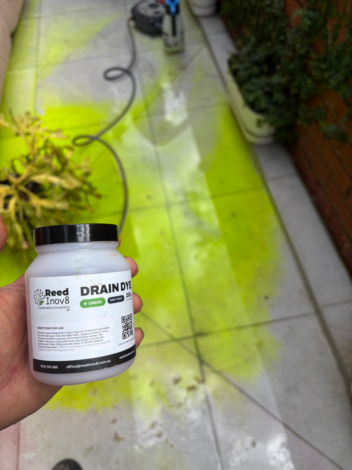 Reed Inov8 green Drain Dye being used outdoors